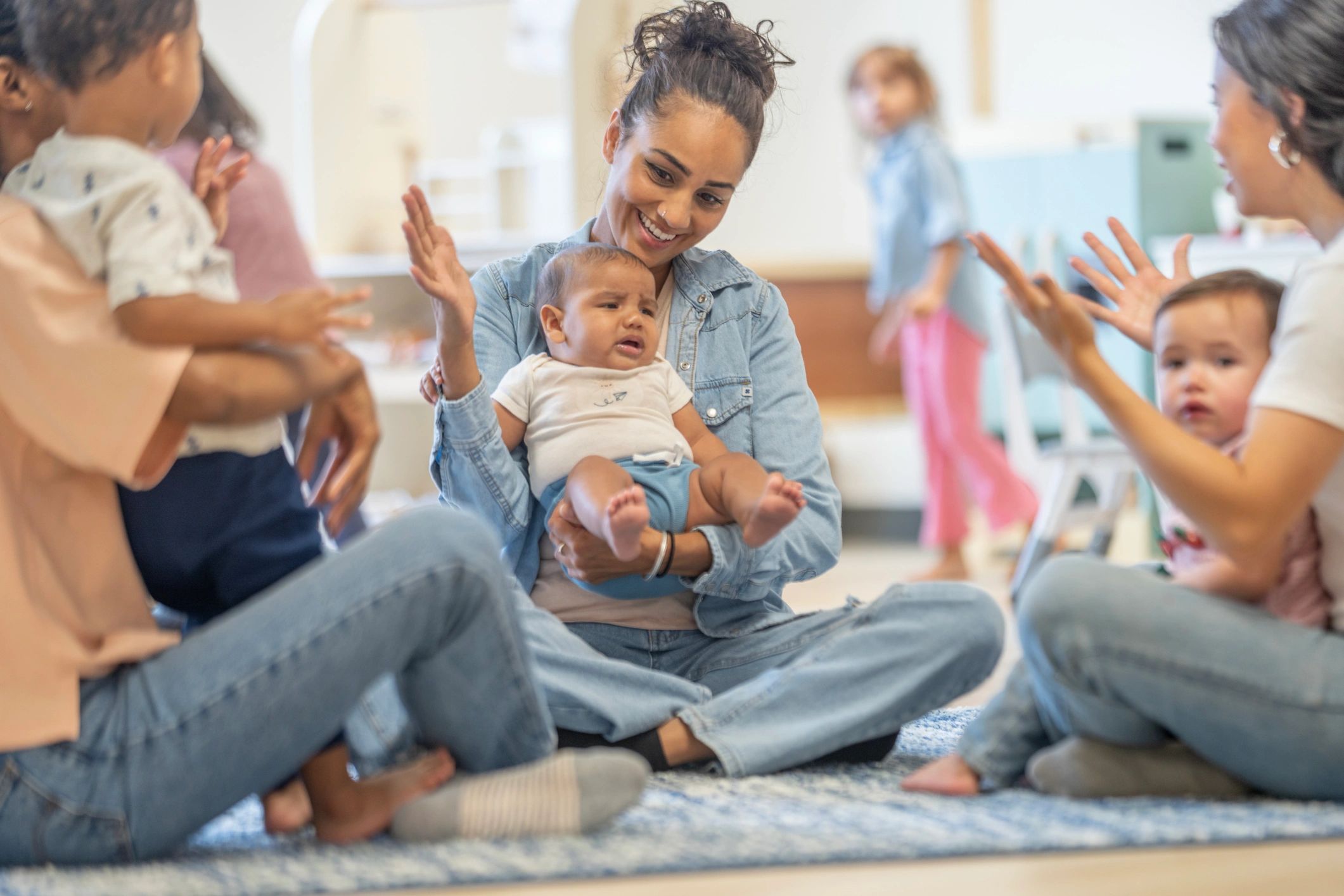 childcare teacher nurturing infant